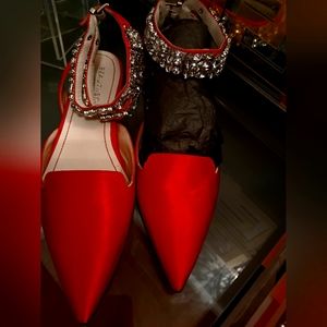 Beautiisoles satin flats with crystal stones around the straps.